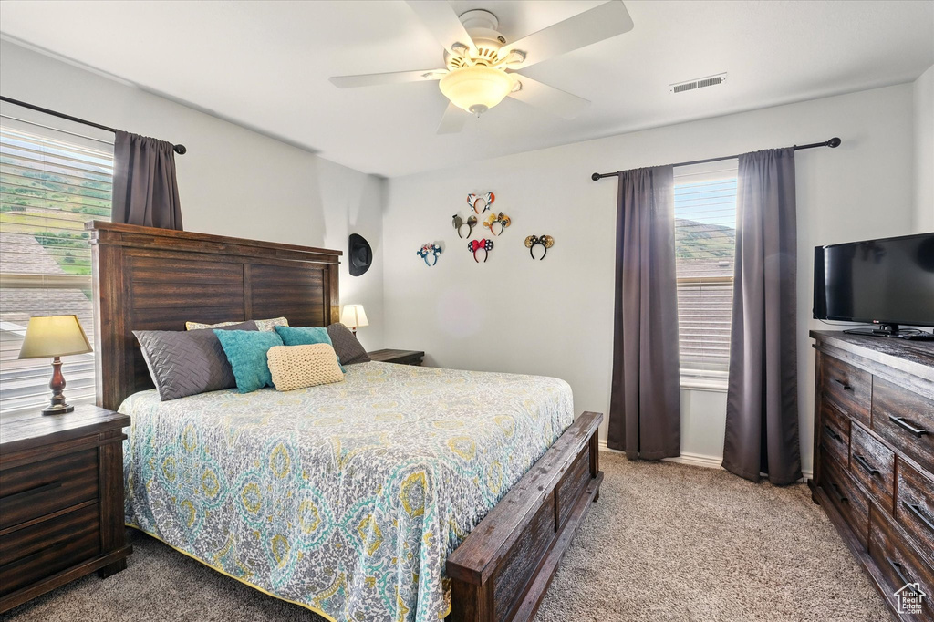 Bedroom with carpet flooring and ceiling fan