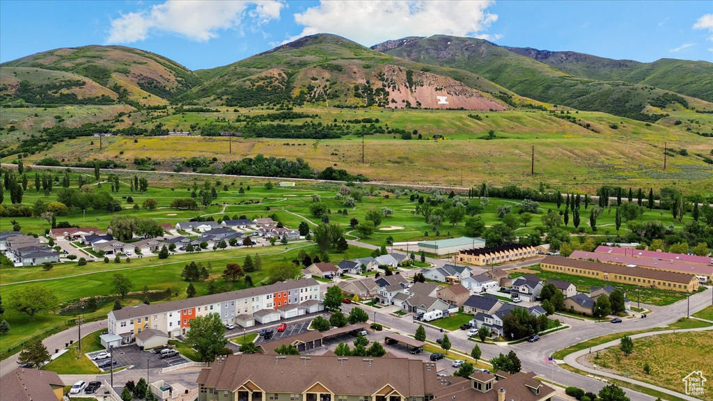 Aerial view of property and surrounding area featuring mountains