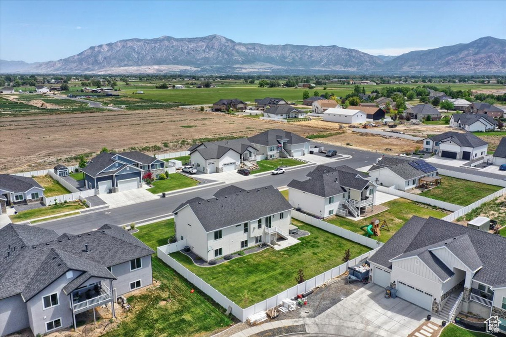 Aerial perspective of suburban area featuring a mountain backdrop