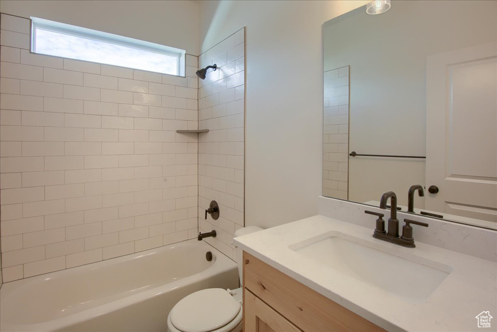 Full bathroom featuring vanity and shower / bathtub combination