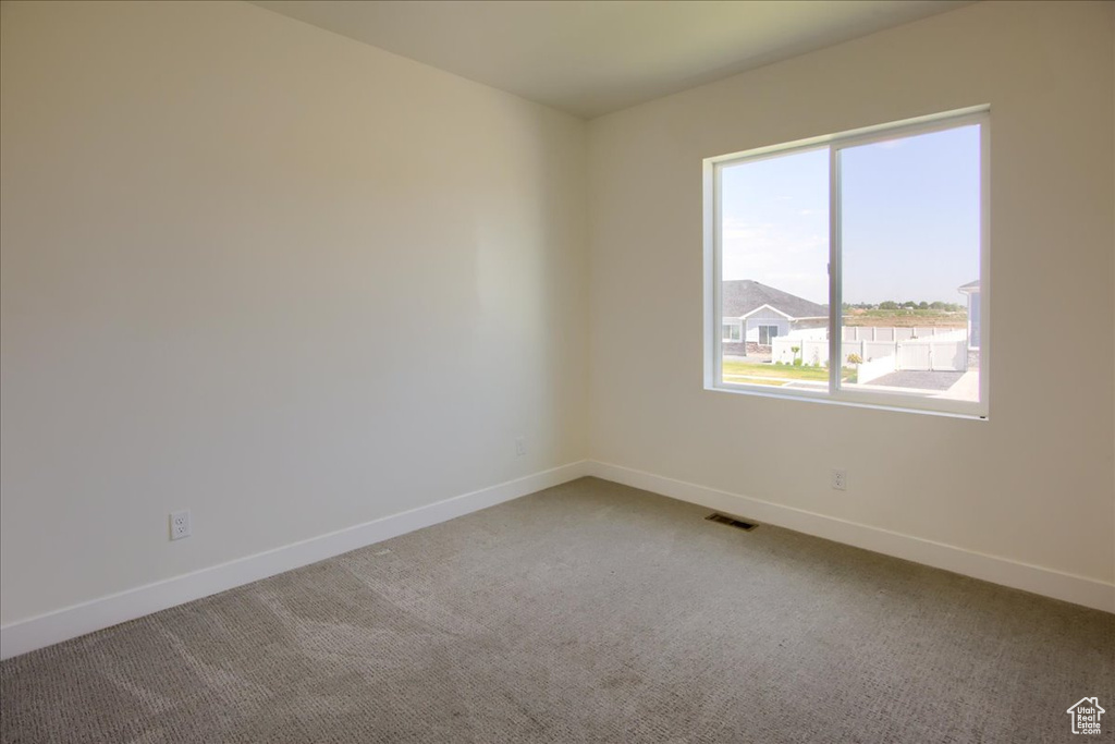 Empty room featuring carpet floors