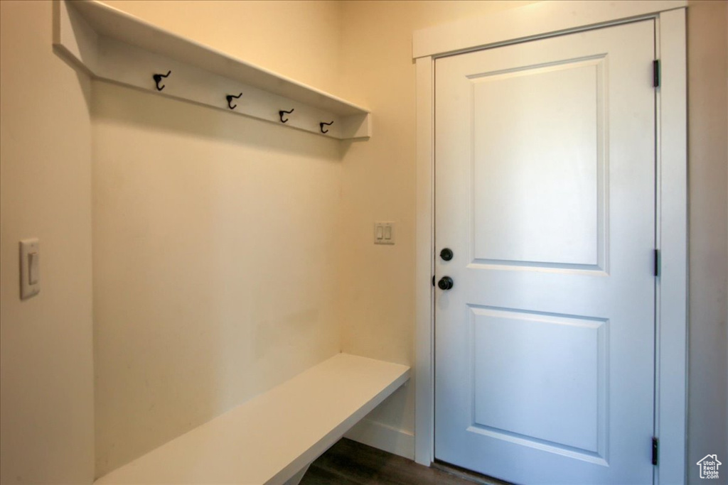 Mudroom featuring dark wood-style flooring