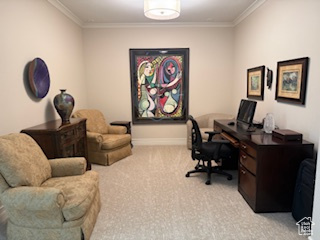 Carpeted office with crown molding