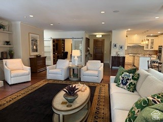 Living room featuring wood finished floors and recessed lighting
