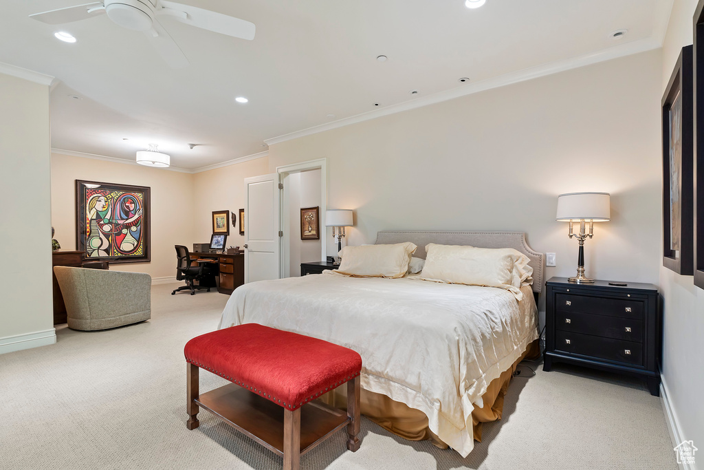 Bedroom with light carpet, a desk, ornamental molding, and recessed lighting