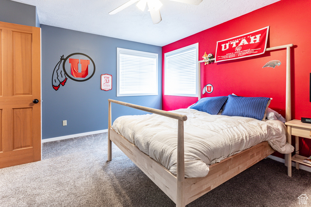 Bedroom with carpet and ceiling fan