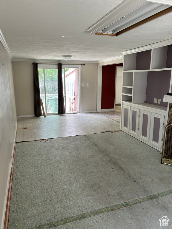 Spare room featuring baseboards and ornamental molding