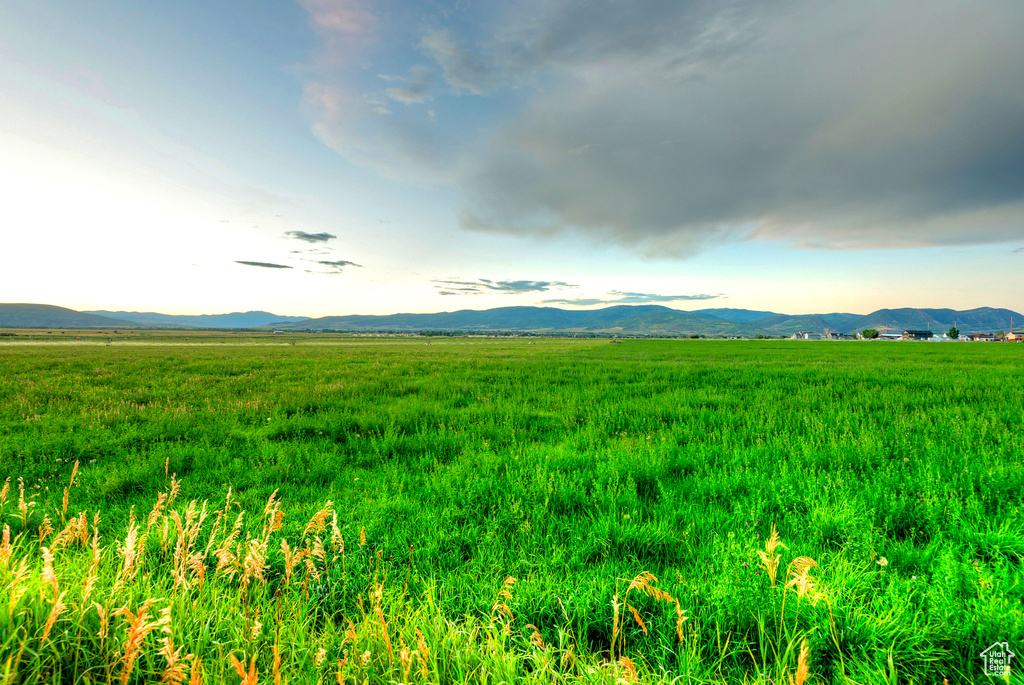 View of mountain backdrop with rural landscape