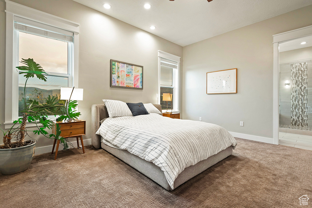 Carpeted bedroom featuring recessed lighting, baseboards, and ensuite bathroom
