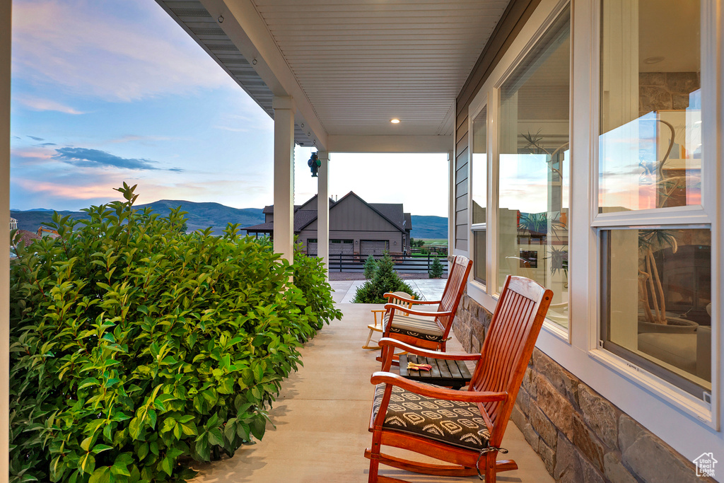 Covered porch with a mountain view