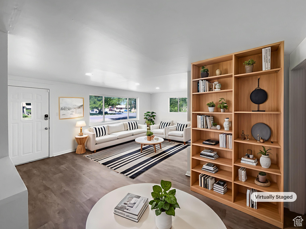 Living area featuring wood finished floors and baseboards