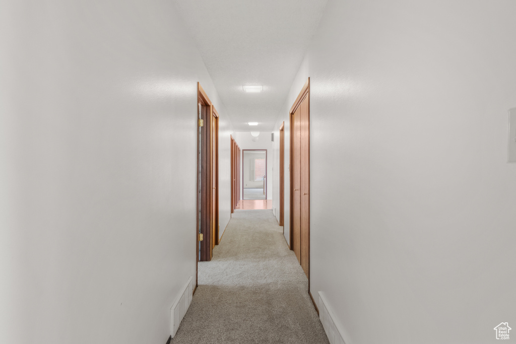 Hall with light colored carpet