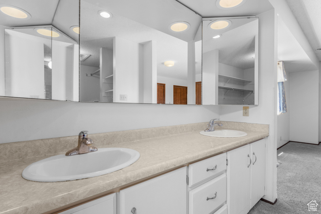 Full bath featuring double vanity