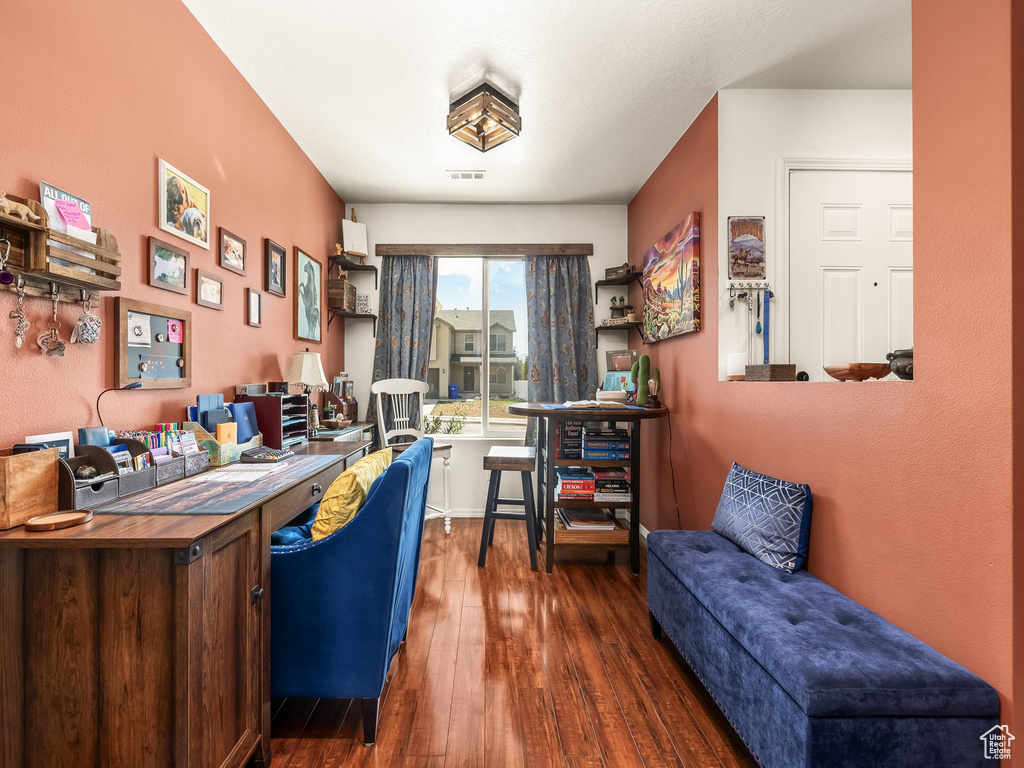 Office with hardwood / wood-style flooring