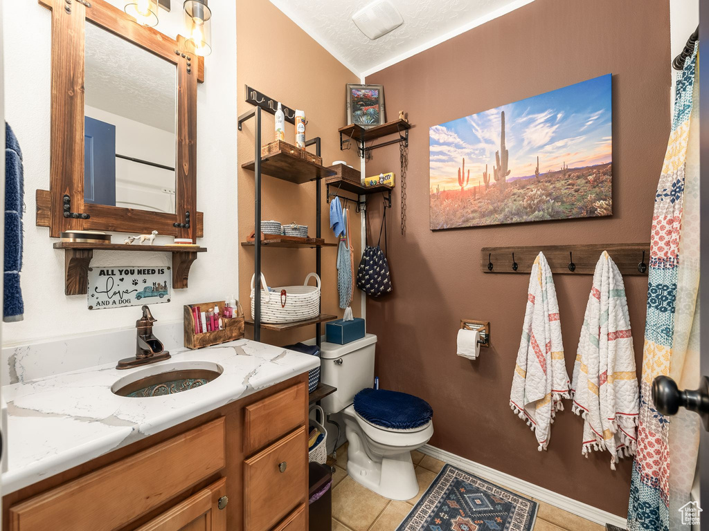 Bathroom with vanity and tile patterned flooring