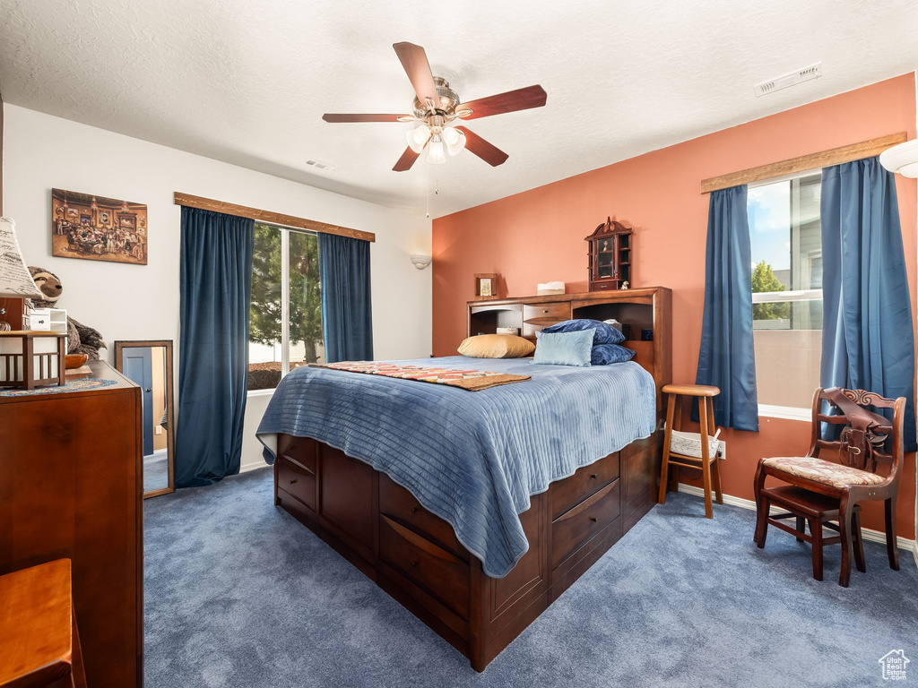 Bedroom featuring carpet floors and a ceiling fan