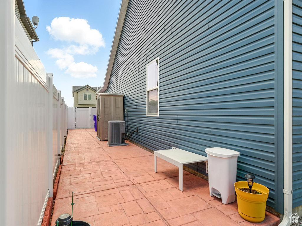 Fenced backyard with a patio