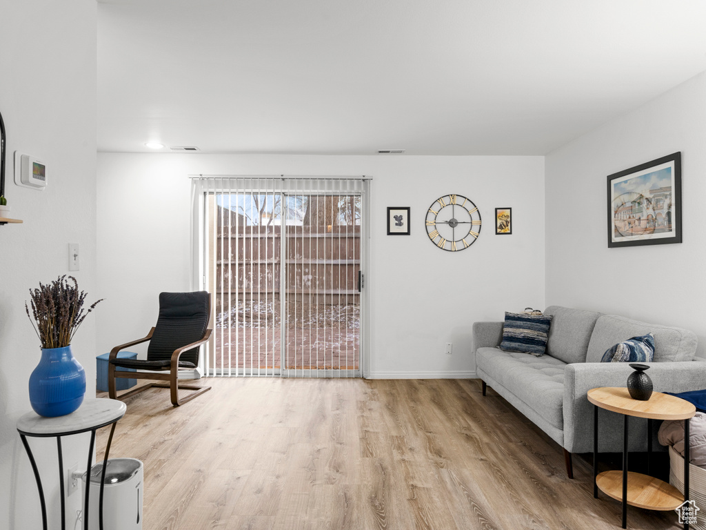 Living area featuring wood finished floors and baseboards