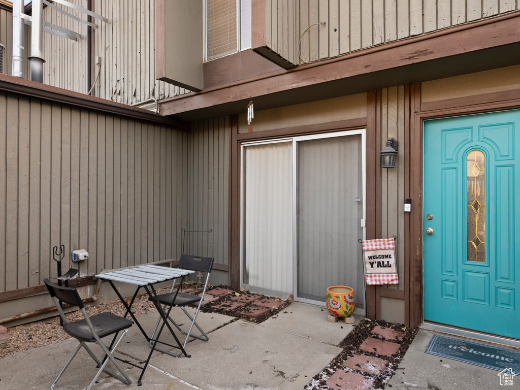 Doorway to property with a patio