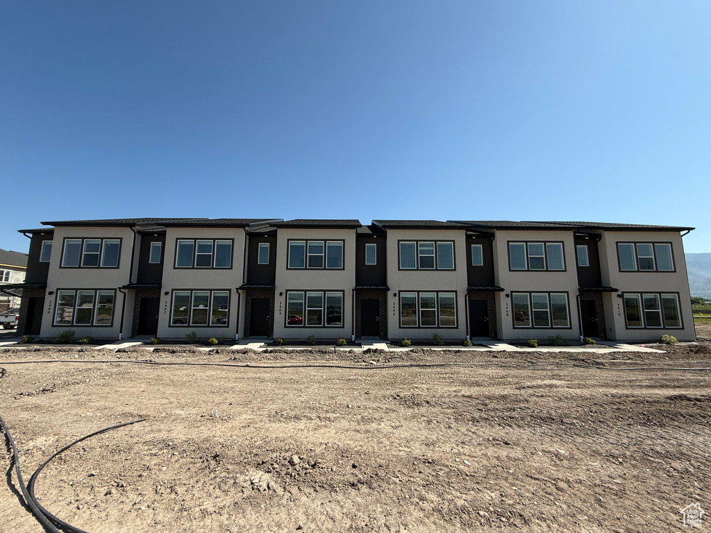View of front of house featuring stucco siding