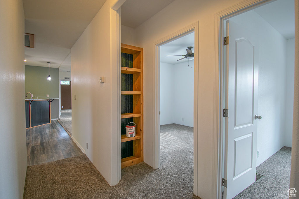 Hall featuring carpet flooring