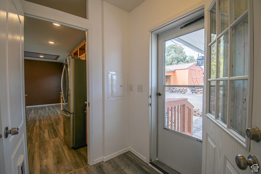 Entryway featuring dark wood-style floors, recessed lighting, and electric panel