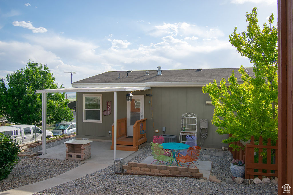 Rear view of house with a patio area