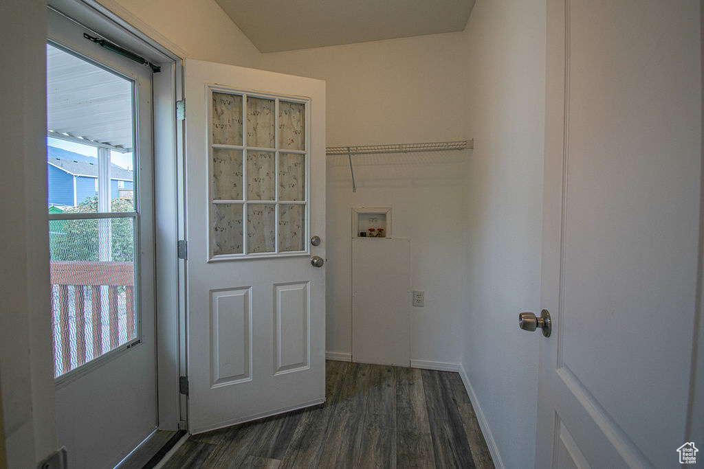 Laundry area with dark wood-style floors and hookup for a washing machine
