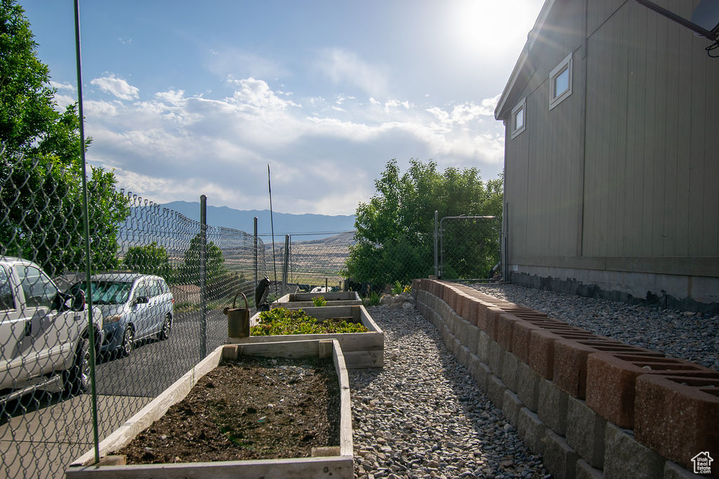 View of yard featuring a mountain view and a garden