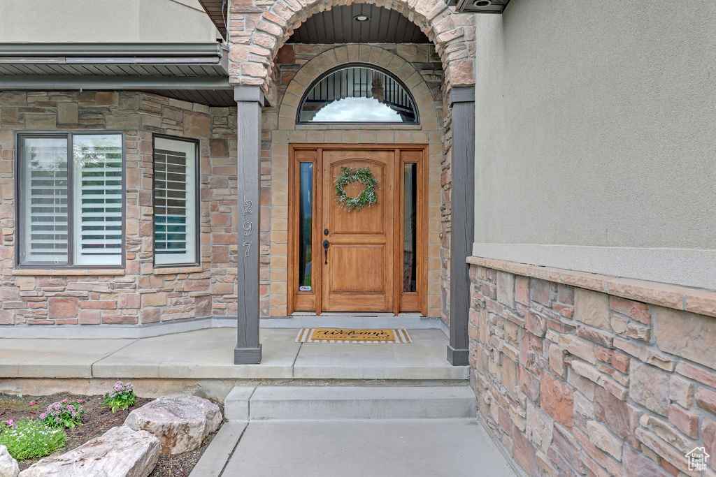 Property entrance with stone siding