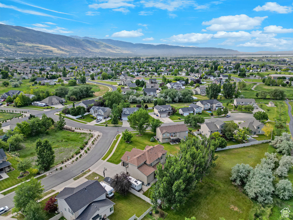 Aerial view of residential area featuring a mountain backdrop