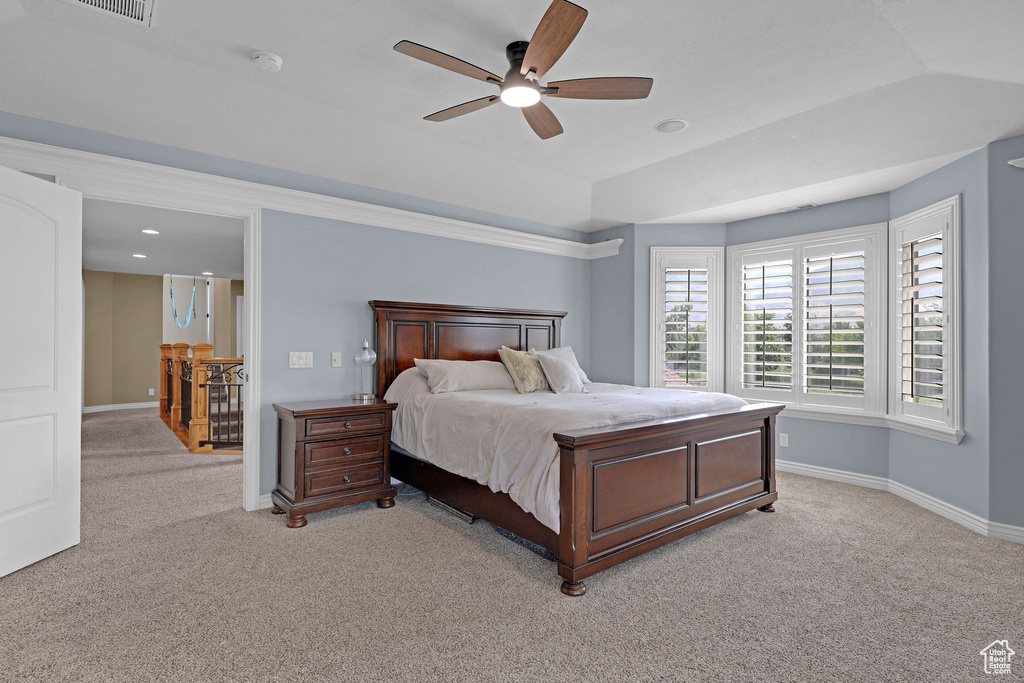Bedroom featuring light carpet and ceiling fan