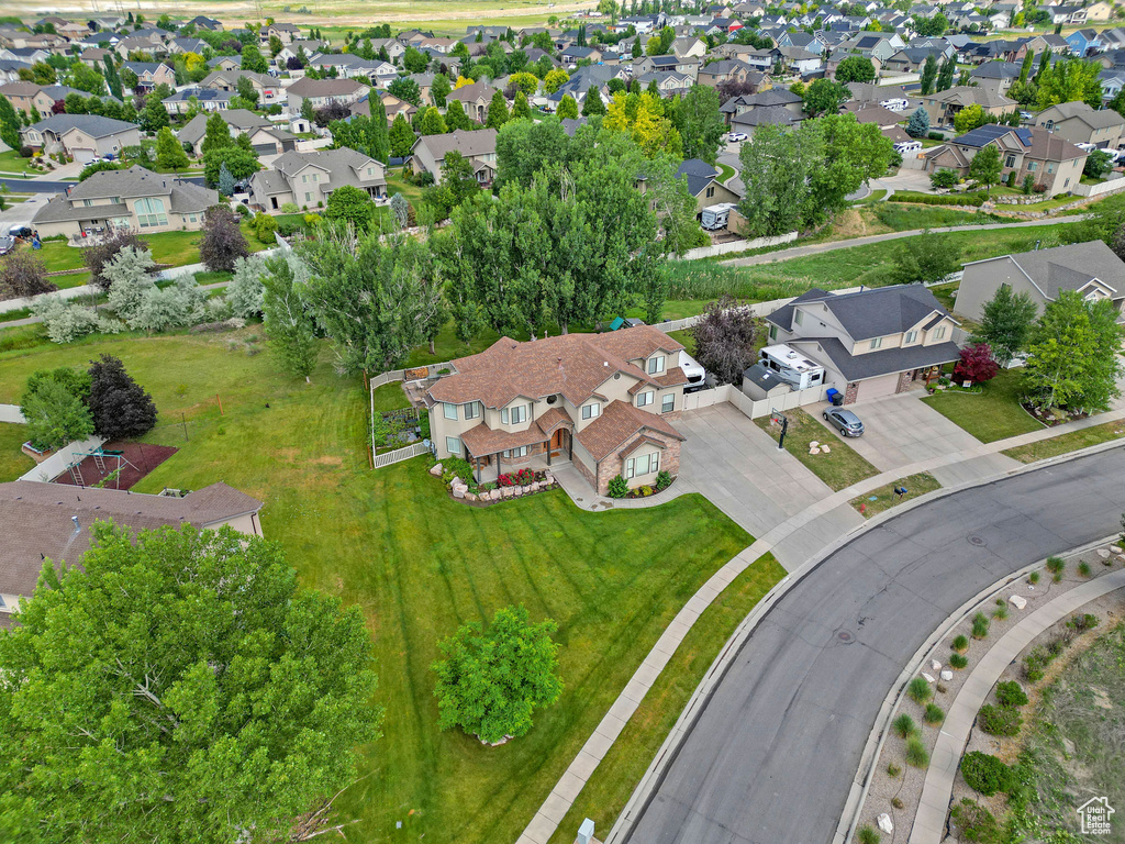 Aerial overview of property's location with nearby suburban area
