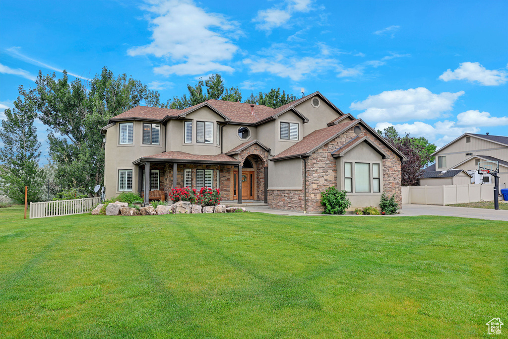 View of front of property featuring stucco siding and stone siding