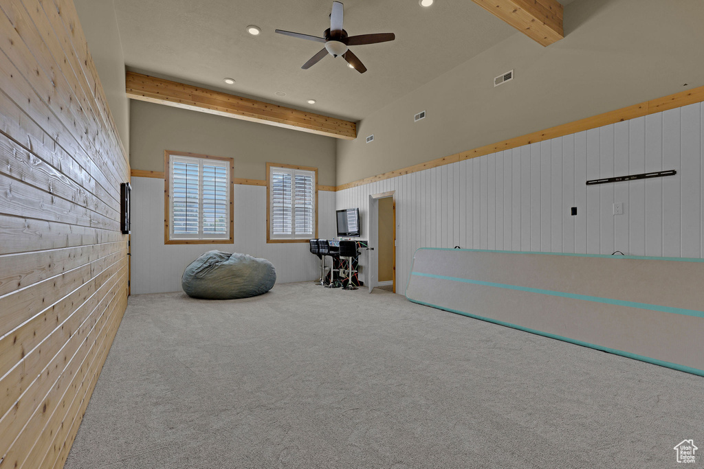 Miscellaneous room with beam ceiling, ceiling fan, carpet, recessed lighting, and wainscoting