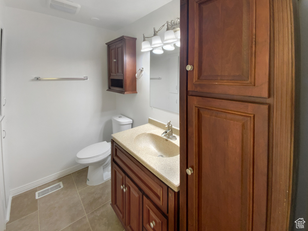 Bathroom with vanity and tile patterned flooring