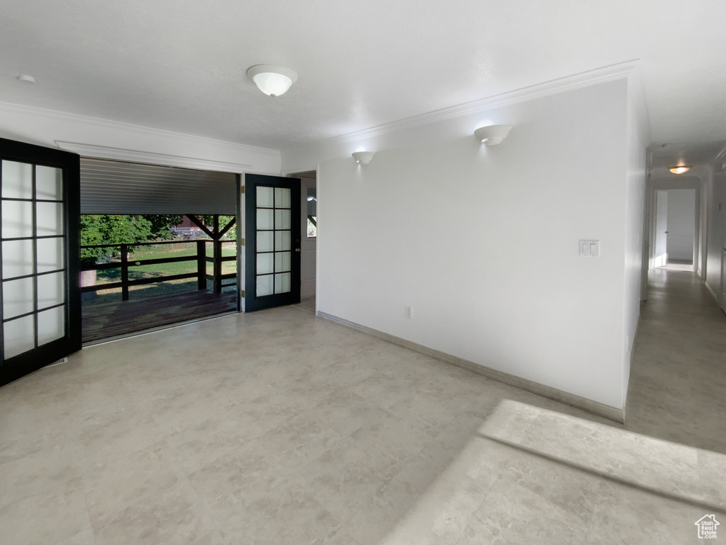 Unfurnished room featuring ornamental molding