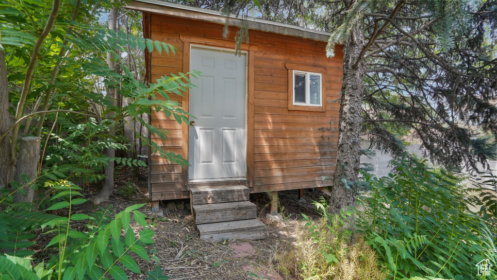 View of outbuilding with entry steps