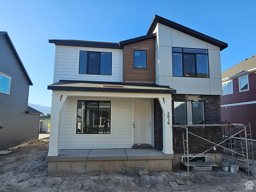 Contemporary house featuring a porch