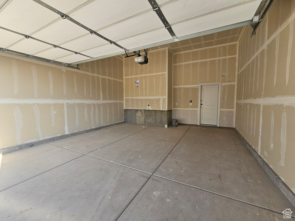 Garage featuring a garage door opener