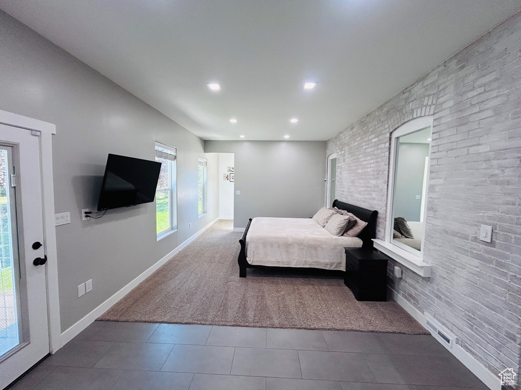 Tiled bedroom featuring recessed lighting and baseboards