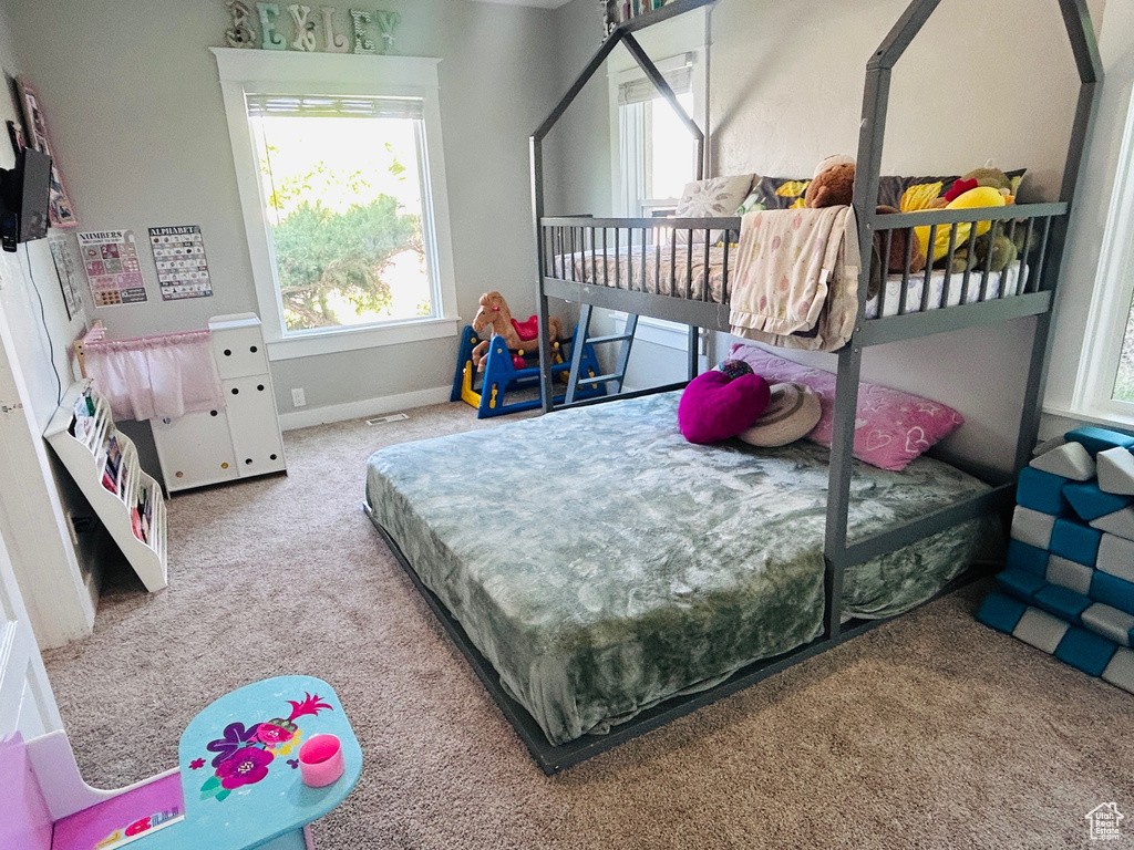 Bedroom with carpet and baseboards