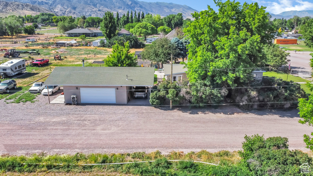 Aerial view of property and surrounding area with mountains