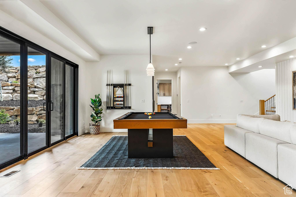 Game room featuring billiards, light wood-style flooring, and recessed lighting