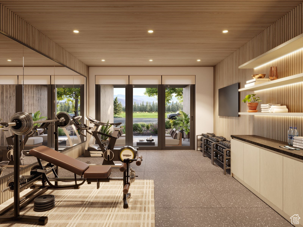 Workout room featuring wood ceiling