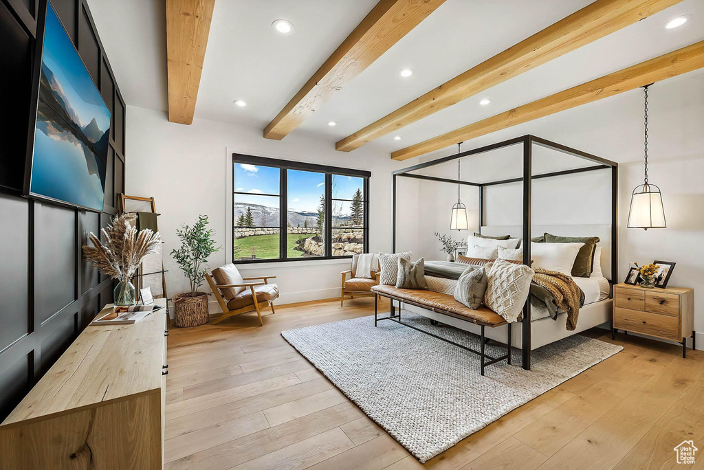 Bedroom featuring recessed lighting, beamed ceiling, and light wood finished floors