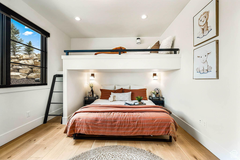Bedroom featuring light wood-style floors and recessed lighting