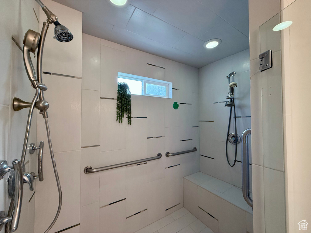 Bathroom featuring a shower, tile patterned flooring, and recessed lighting