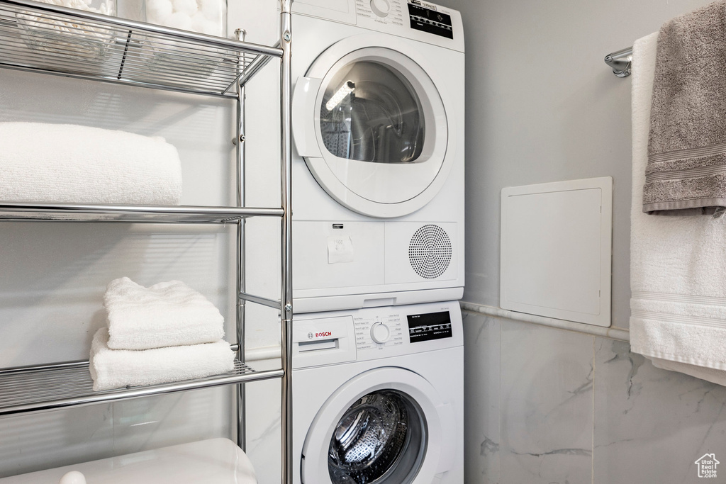 Laundry room with estacked washer and dryer