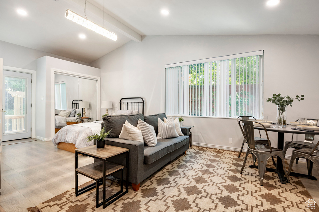 Bedroom with wood finished floors, baseboards, recessed lighting, access to outside, and a closet